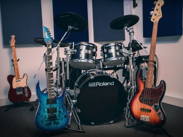 Guitars and drums in drop tuning inside a professional rehearsal studio